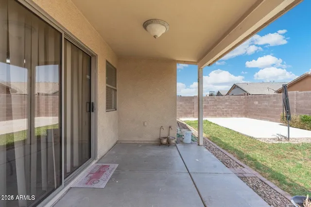 a view of a pathway both side of house
