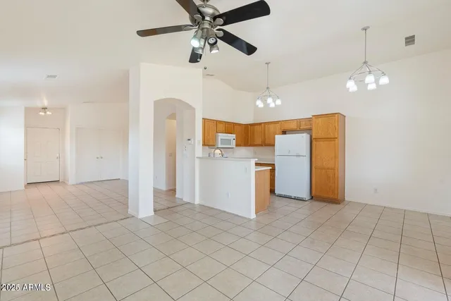a view of a kitchen with a sink and cabinets