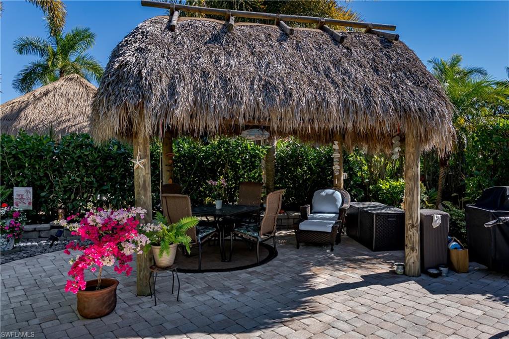 a view of a backyard with sitting area and furniture