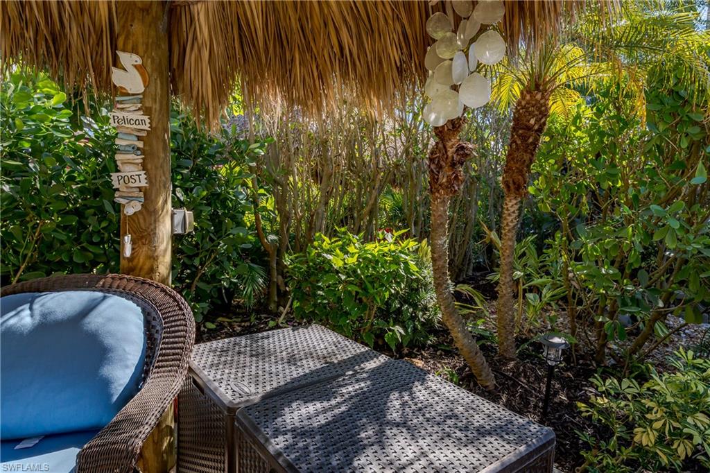 13466 Ladyfish Lane Naples, FL 34114 - Photo 11 of 40 a view of outdoor sitting area in the backyard