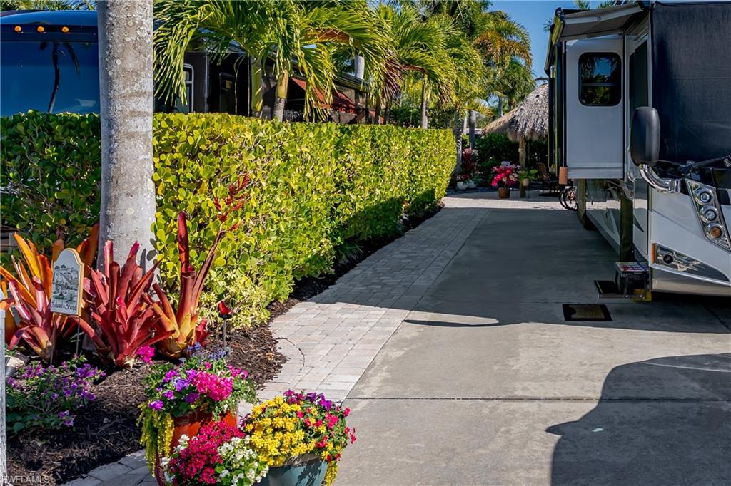 13466 Ladyfish Lane Naples, FL 34114 - Photo 16 of 40 a view of a house with a yard