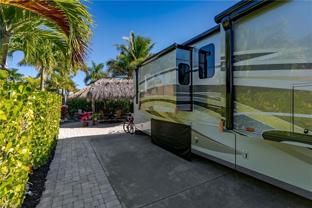13466 Ladyfish Lane Naples, FL 34114 - Photo 19 of 40 a view of a house with a backyard