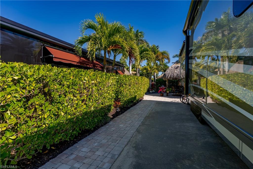 13466 Ladyfish Lane Naples, FL 34114 - Photo 20 of 40 a view of a garden