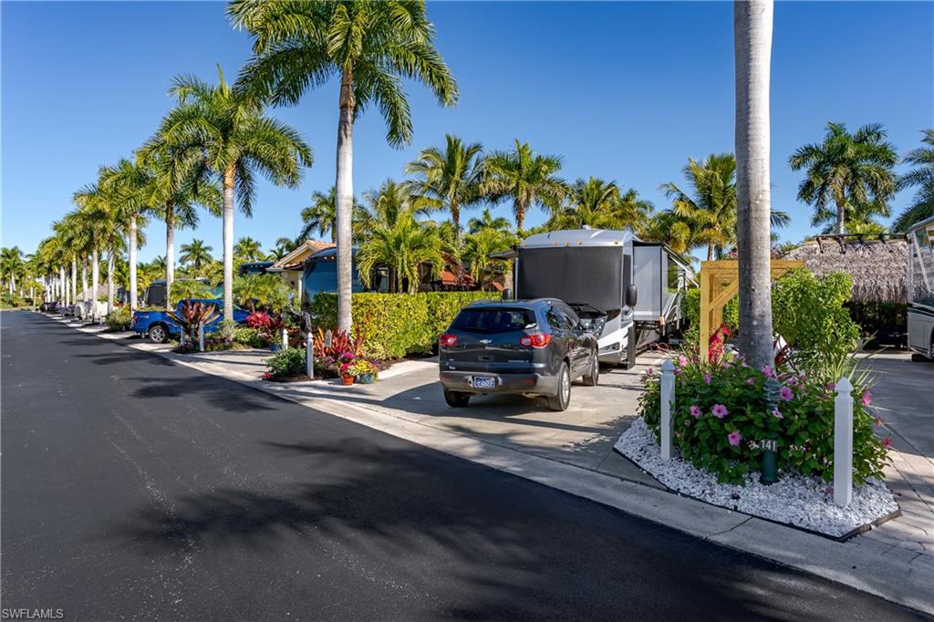 13466 Ladyfish Lane Naples, FL 34114 - Photo 33 of 40 a view of a street with cars