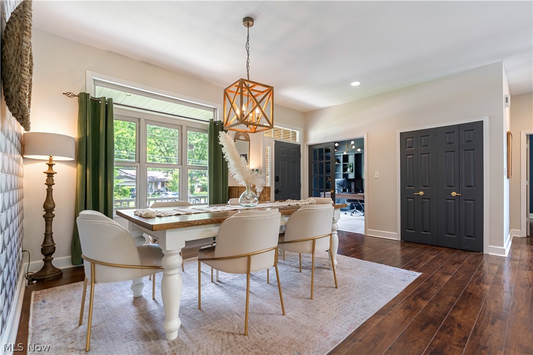 3228 Bancroft Road Akron, OH 44333 - Photo 12 of 50 Dining room featuring an inviting chandelier and wood-type flooring