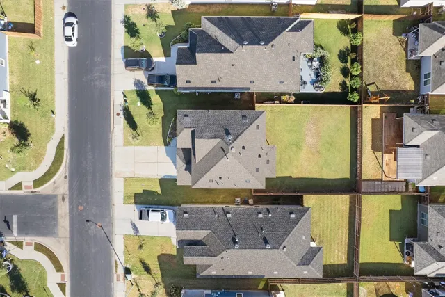 an aerial view of a house with a swimming pool