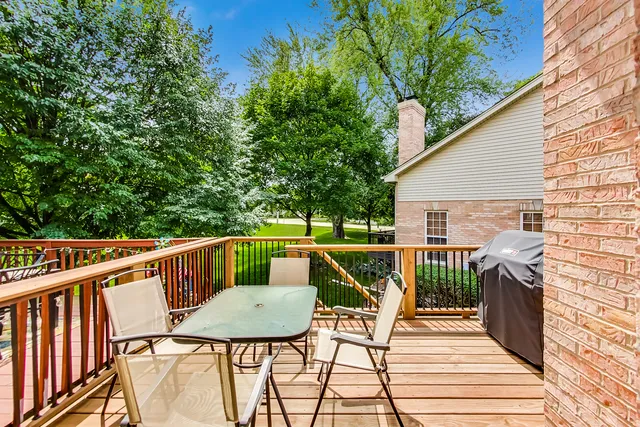 a view of balcony with furniture and wooden deck
