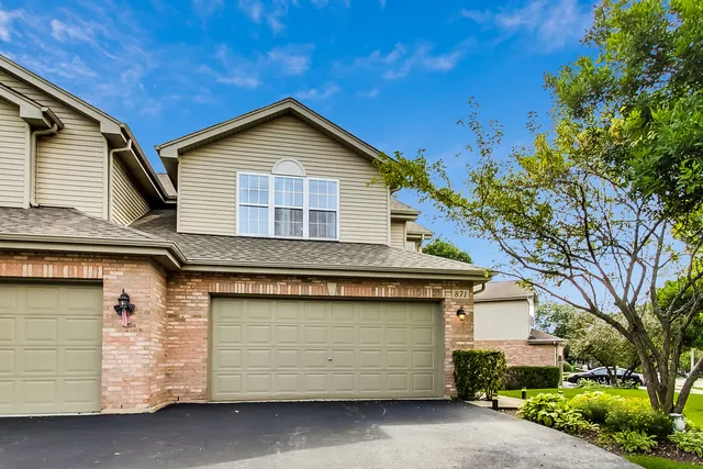 a front view of a house with a garage