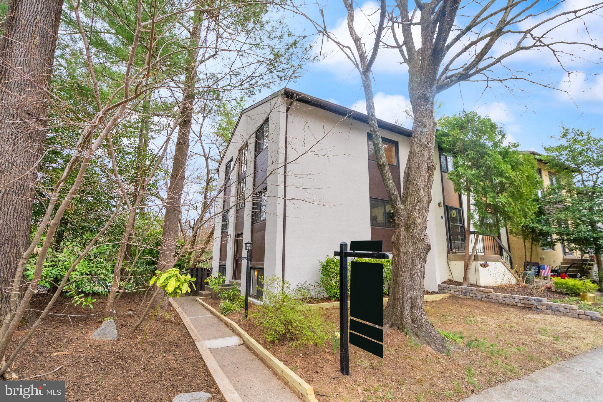 11801 Coopers Court Reston, VA 20191 - Photo 1 of 66 a view of a house with a yard