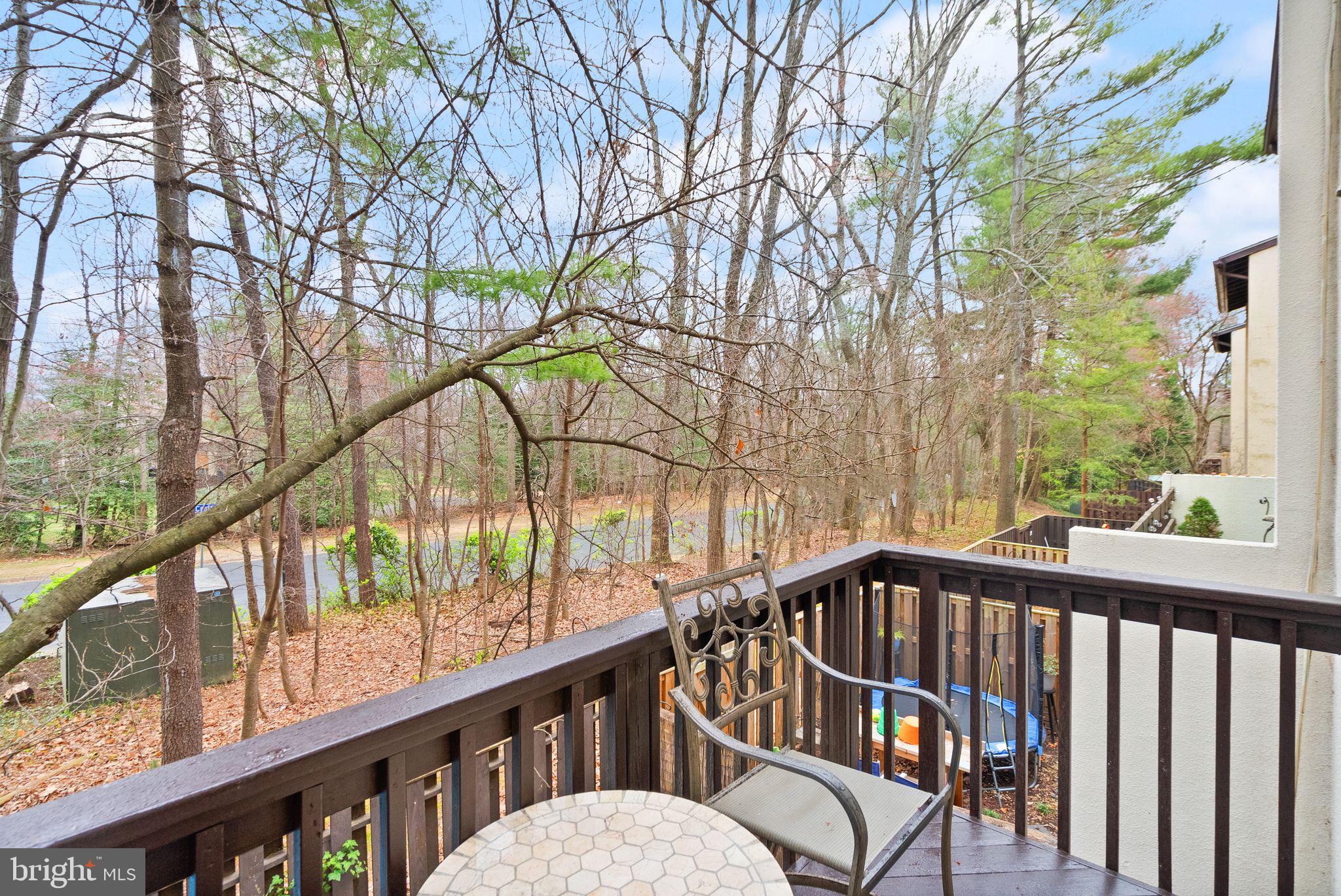 11801 Coopers Court Reston, VA 20191 - Photo 14 of 66 a view of a balcony with wooden floor and fence