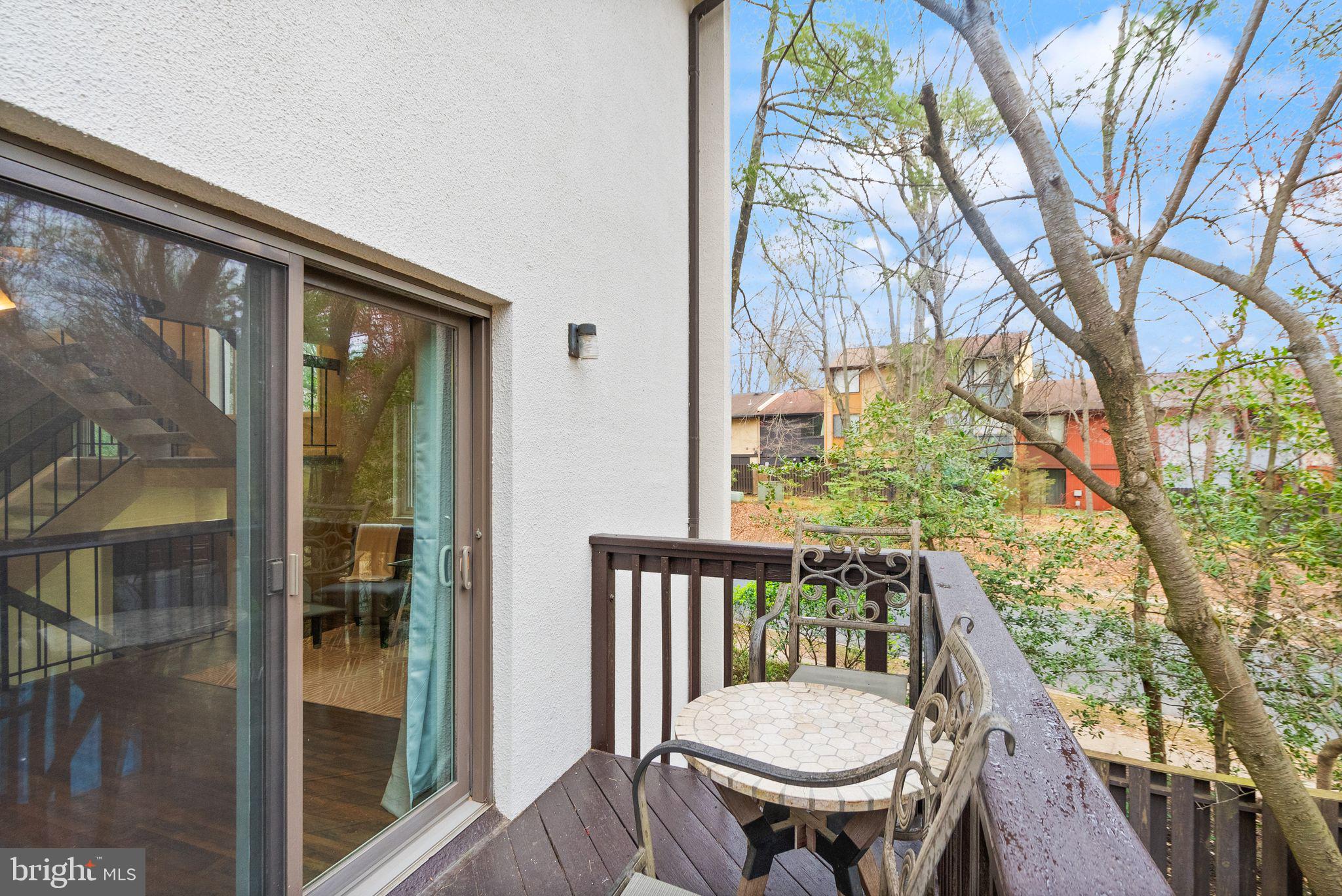 11801 Coopers Court Reston, VA 20191 - Photo 15 of 66 a view of a balcony with table and chairs