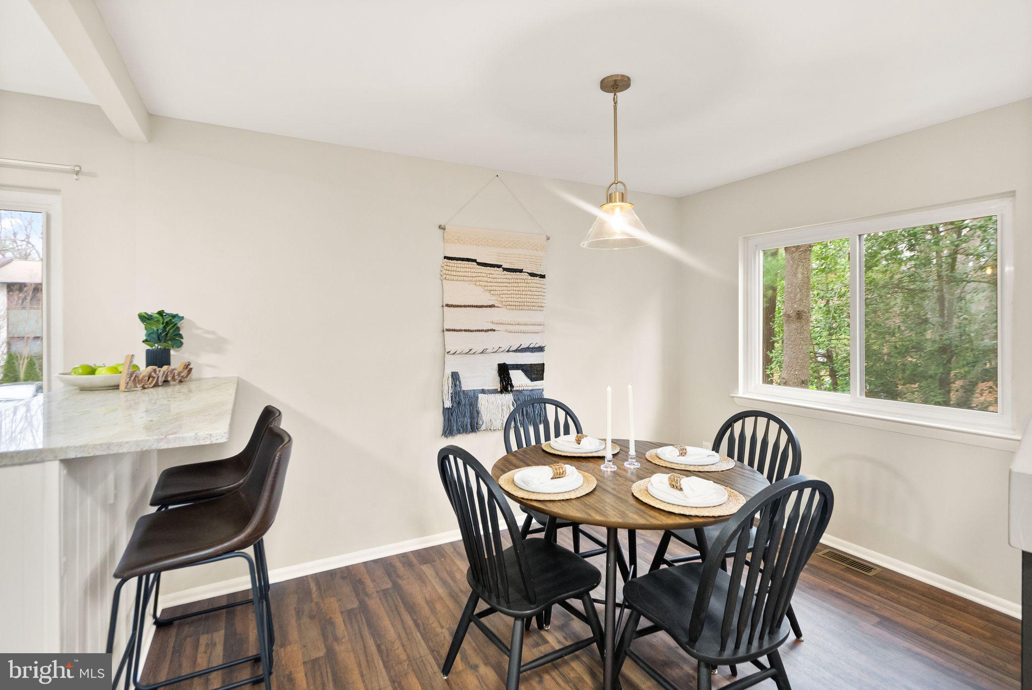 11801 Coopers Court Reston, VA 20191 - Photo 16 of 66 a view of a dining room with furniture window and outside view