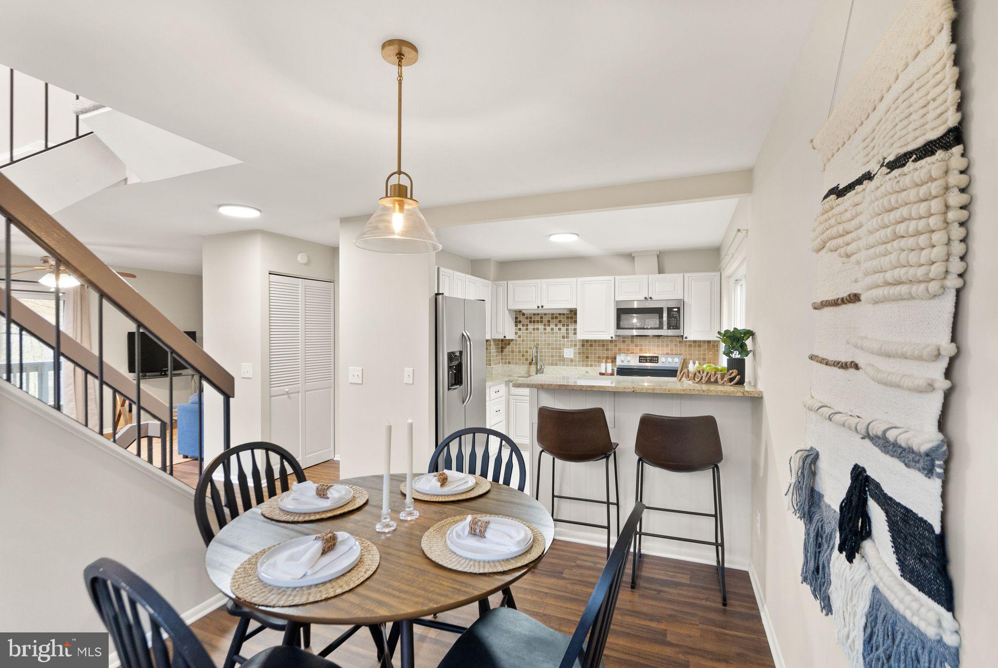 11801 Coopers Court Reston, VA 20191 - Photo 17 of 66 a dining room with furniture a table and chairs