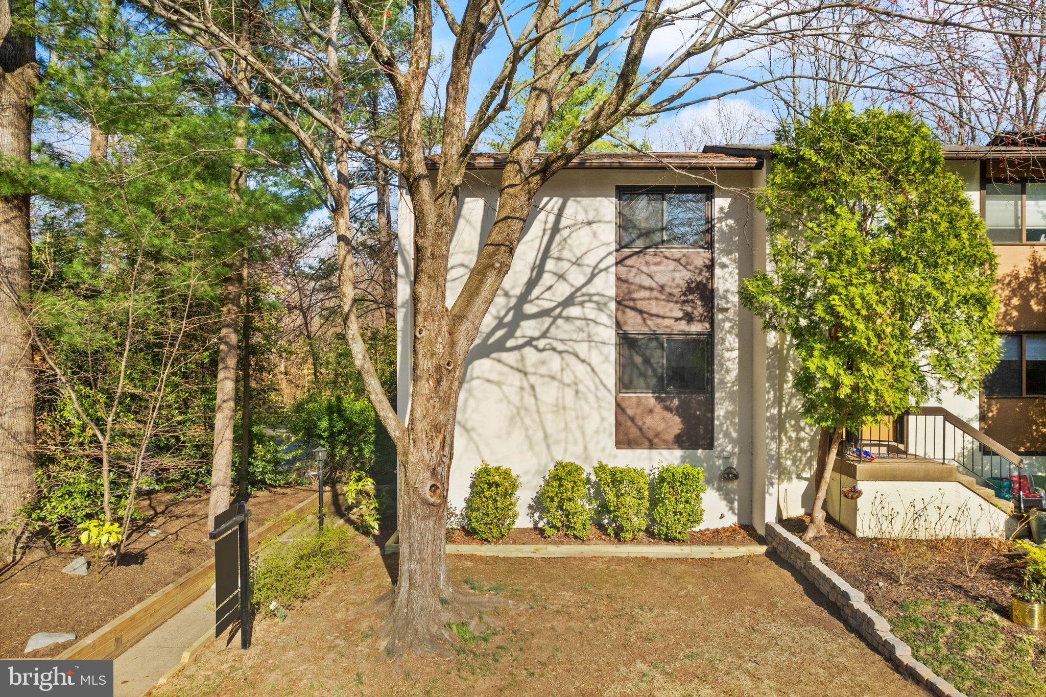 11801 Coopers Court Reston, VA 20191 - Photo 2 of 66 front view of a house with a trees