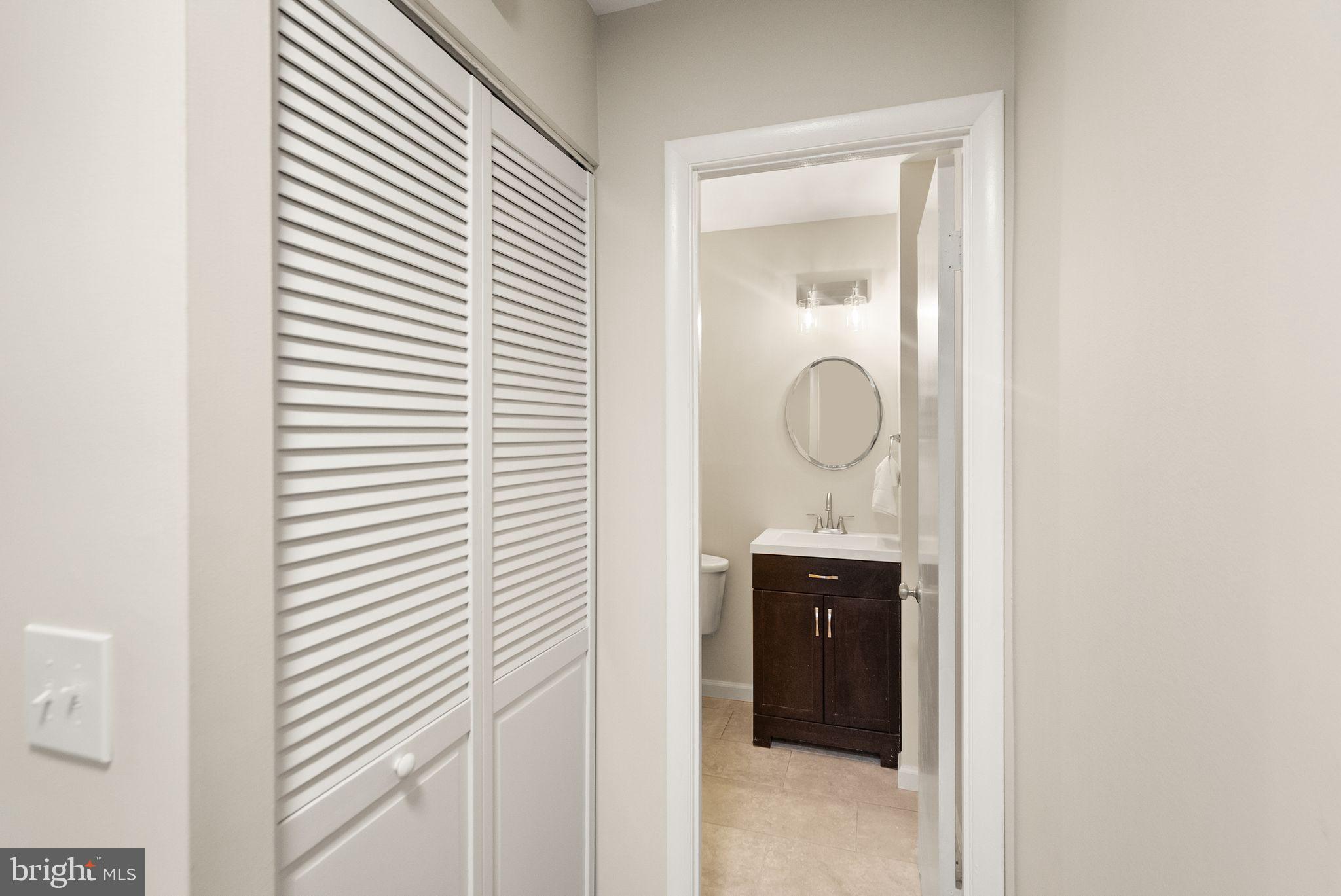 11801 Coopers Court Reston, VA 20191 - Photo 23 of 66 a bathroom with a sink and mirror