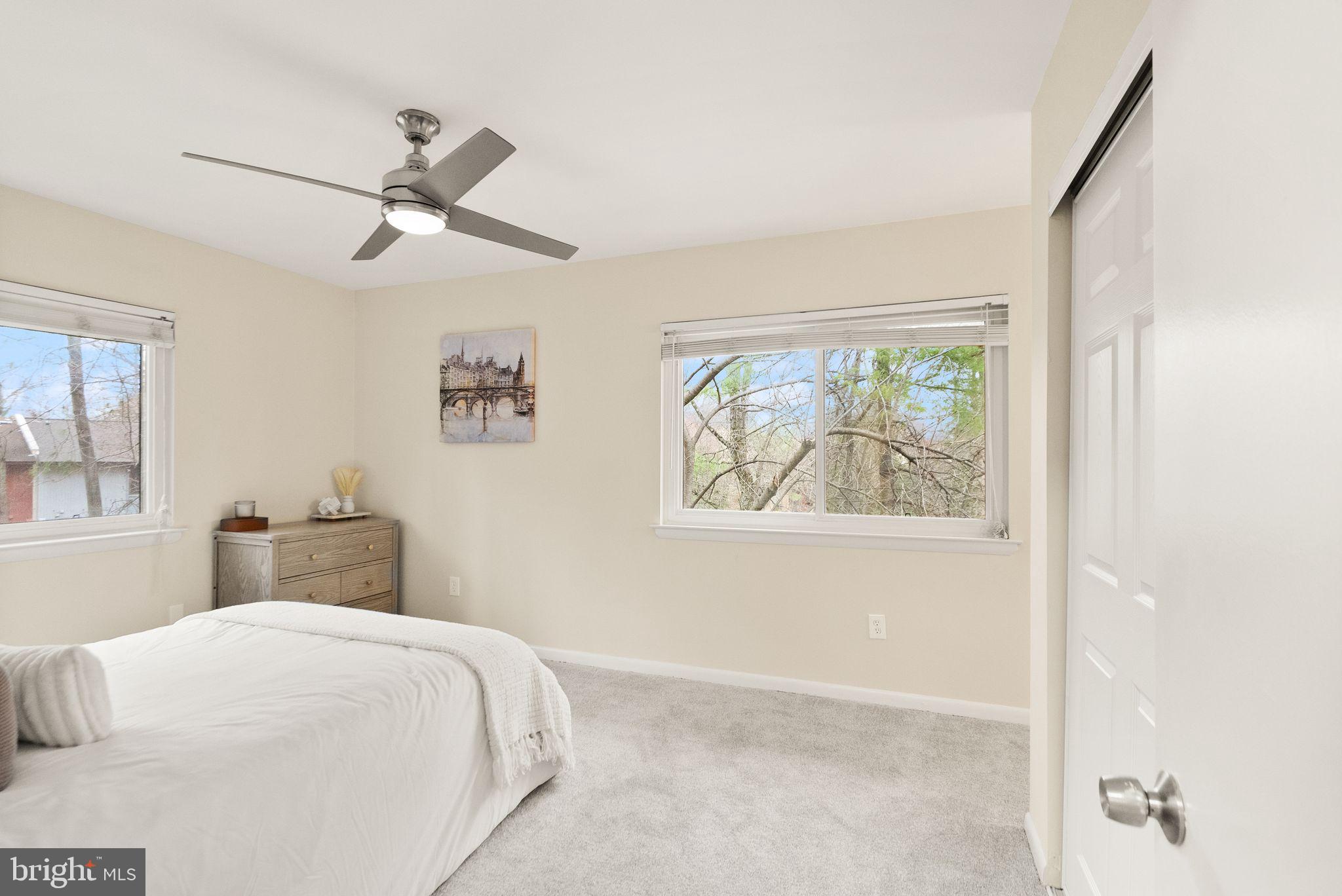 11801 Coopers Court Reston, VA 20191 - Photo 27 of 66 a bedroom with a large bed and a window