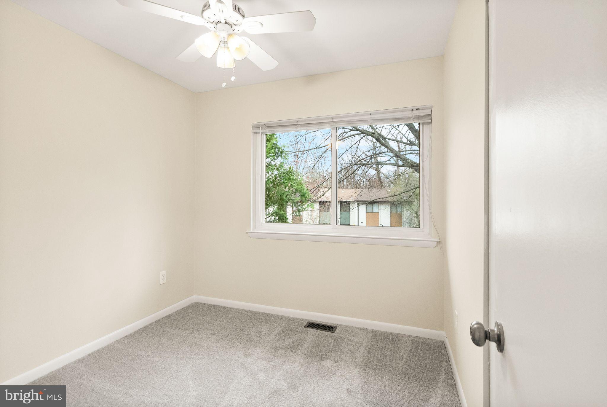 11801 Coopers Court Reston, VA 20191 - Photo 35 of 66 an empty room with a window and a fan