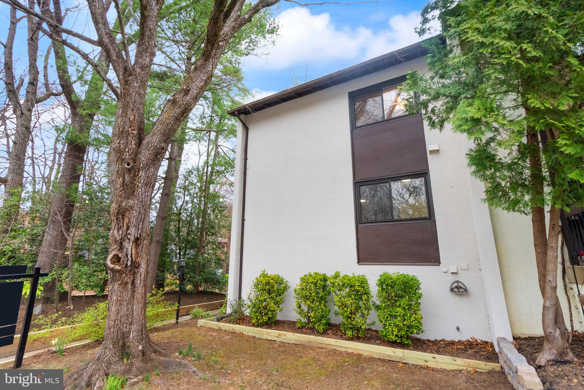 11801 Coopers Court Reston, VA 20191 - Photo 4 of 66 a front view of a house with garden