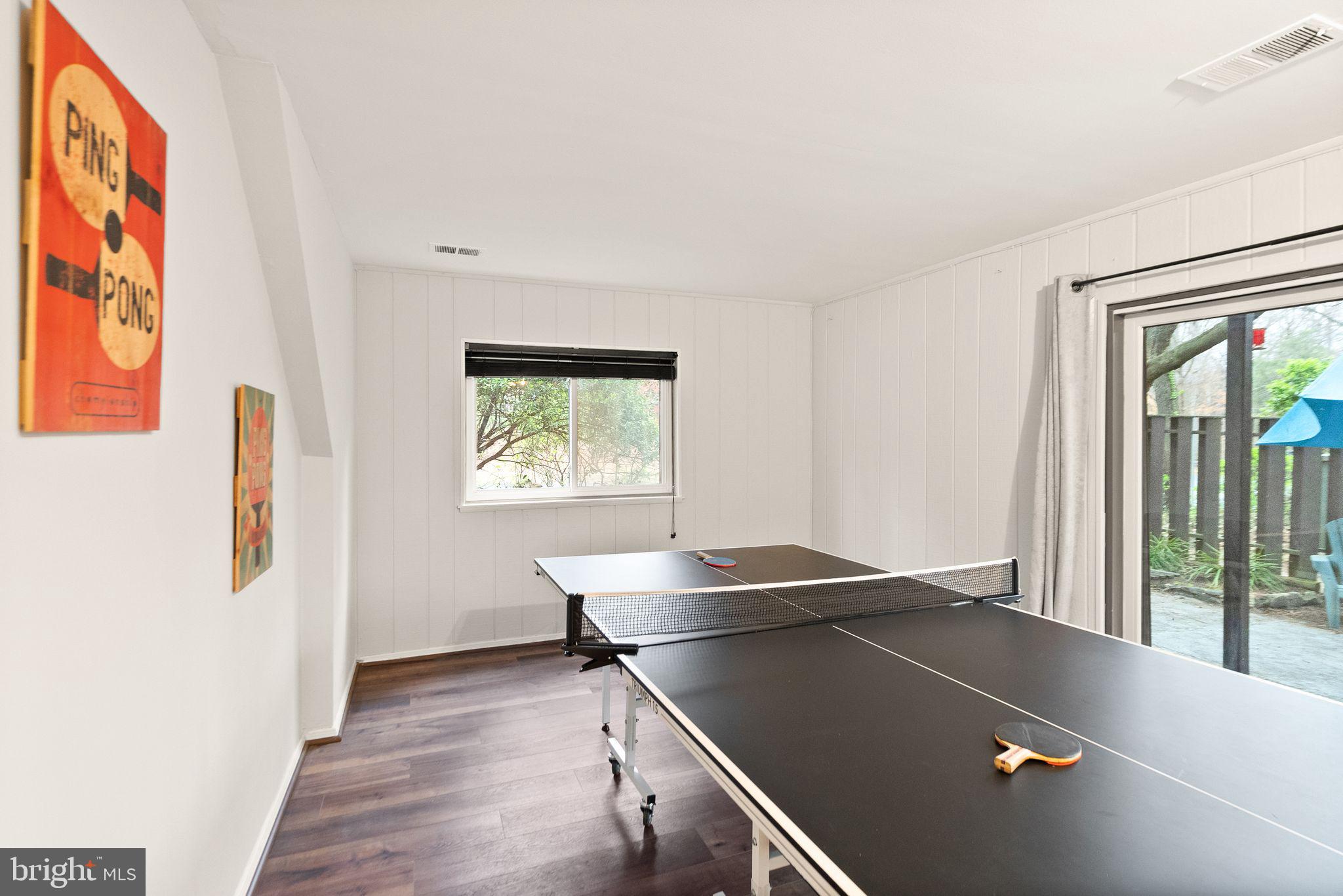 11801 Coopers Court Reston, VA 20191 - Photo 45 of 66 a living room with a table and a window