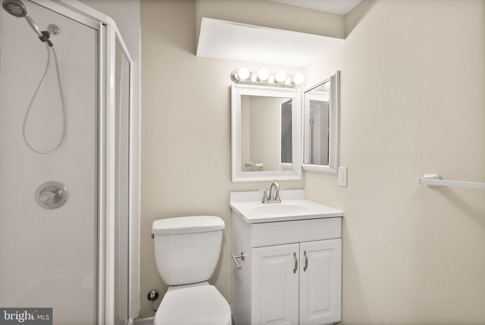 11801 Coopers Court Reston, VA 20191 - Photo 49 of 66 a bathroom with a toilet sink shower and mirror