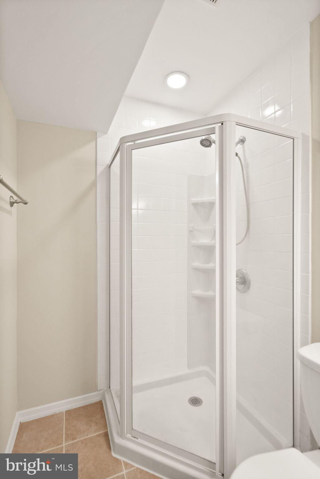 11801 Coopers Court Reston, VA 20191 - Photo 50 of 66 a bathroom with a glass shower door