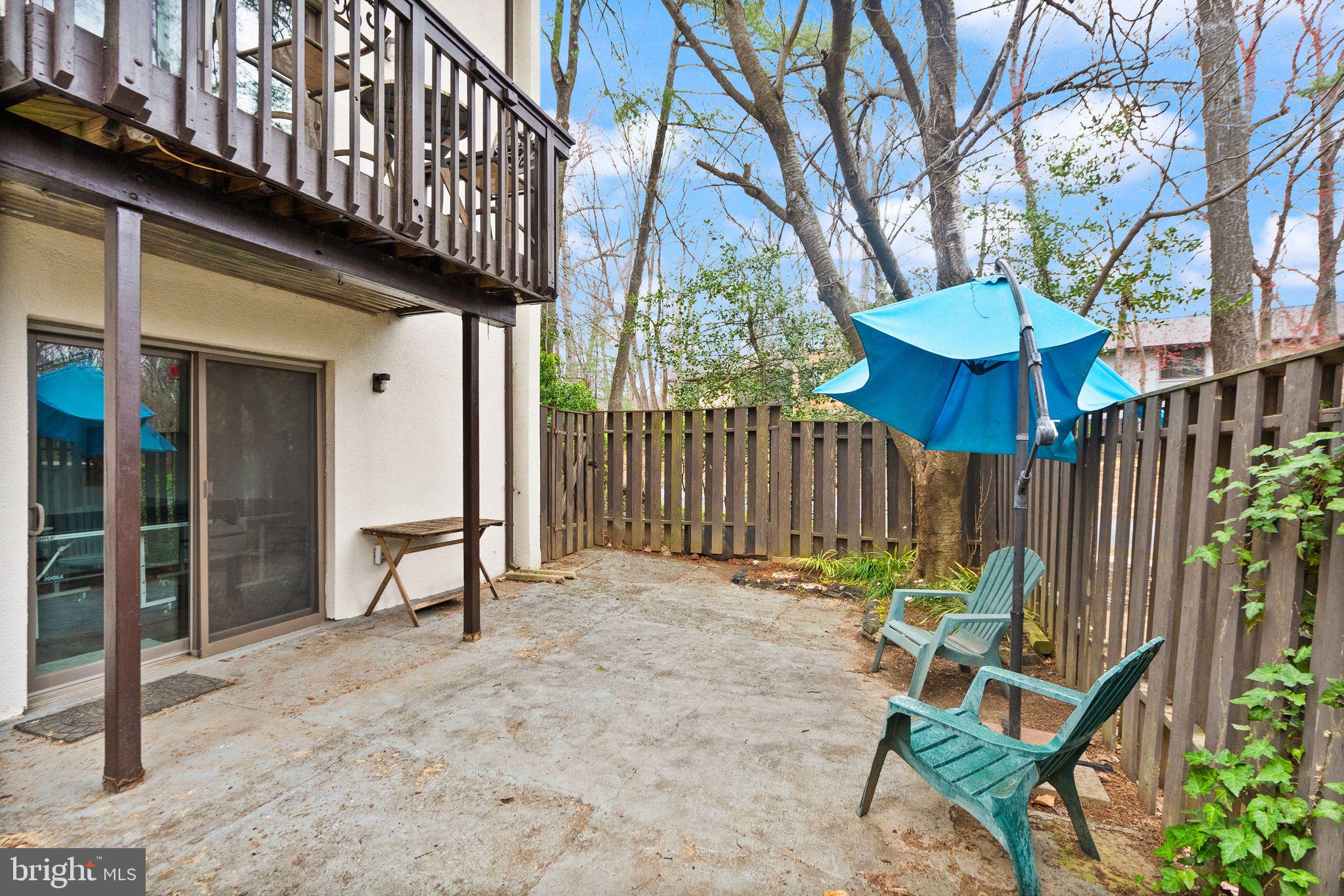 11801 Coopers Court Reston, VA 20191 - Photo 51 of 66 a view of a chair and table in backyard of the house