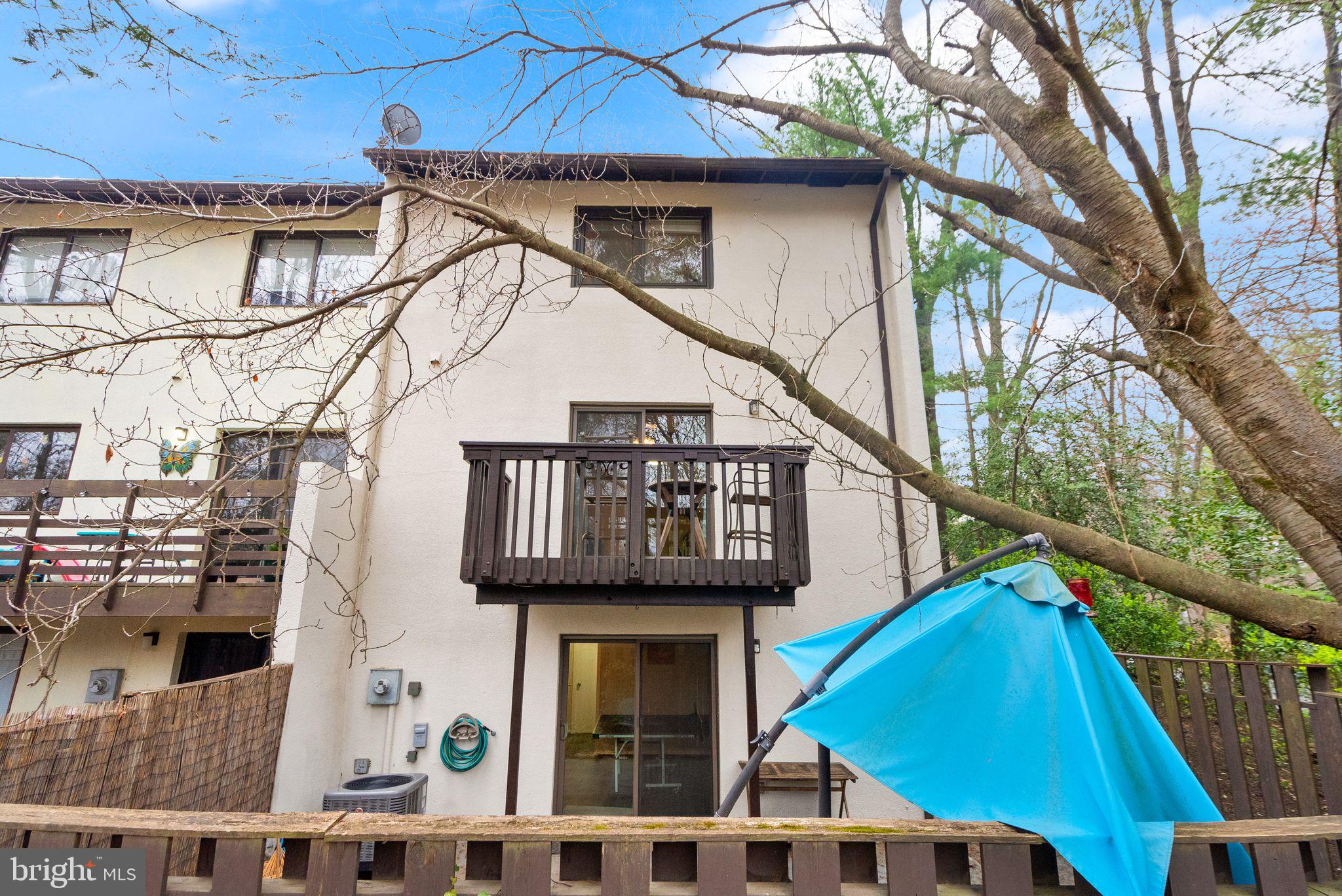11801 Coopers Court Reston, VA 20191 - Photo 53 of 66 a view of a house with wooden stairs and a small yard