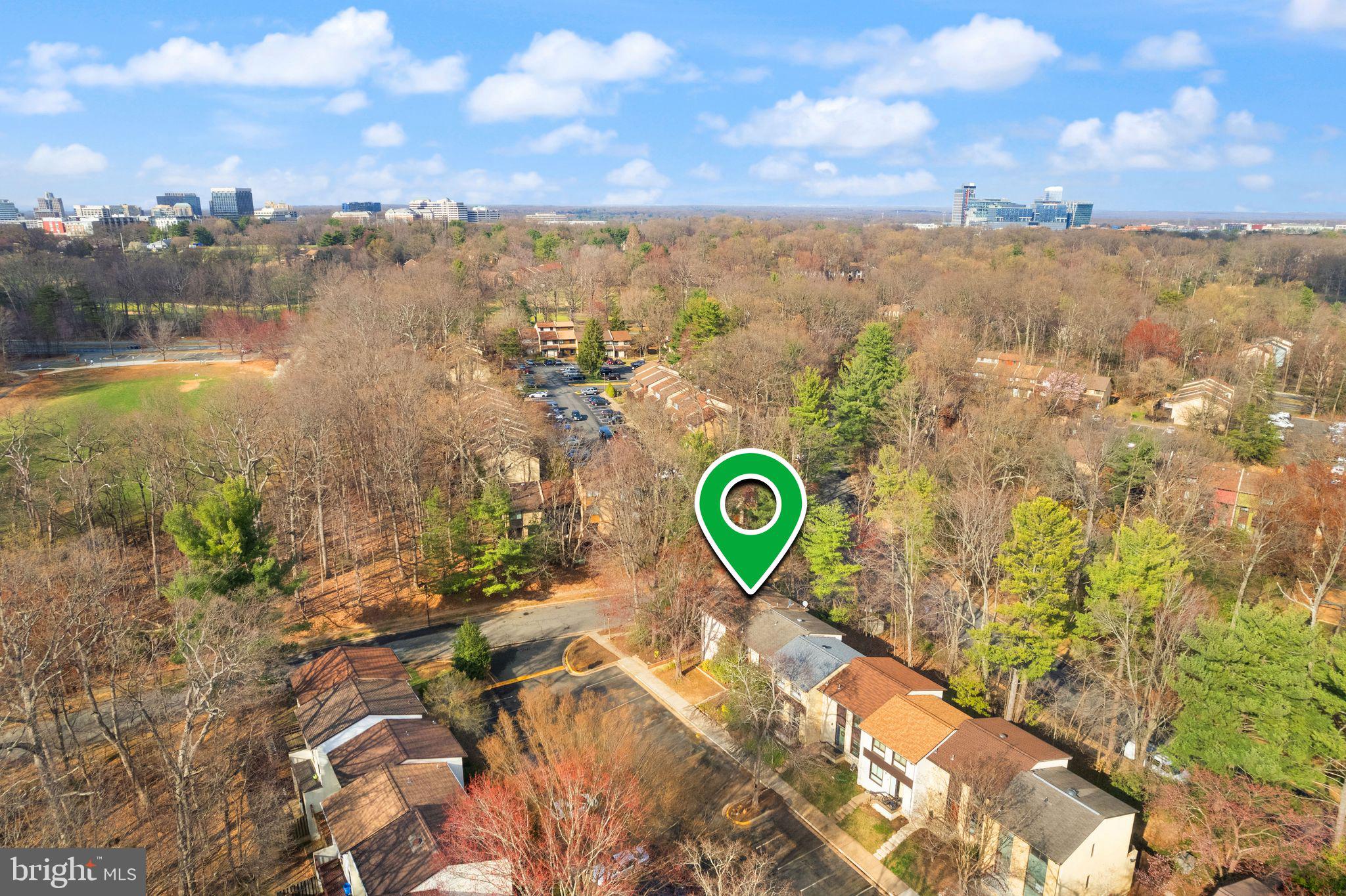 11801 Coopers Court Reston, VA 20191 - Photo 59 of 66 a view of a lake with a building in the background
