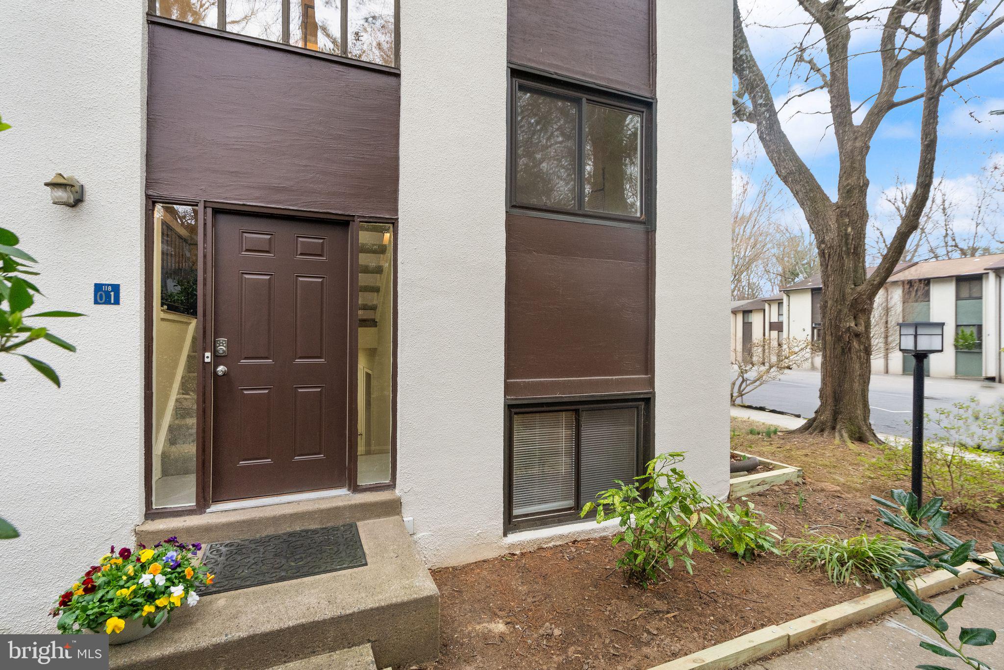 11801 Coopers Court Reston, VA 20191 - Photo 6 of 66 a front view of a house with a yard