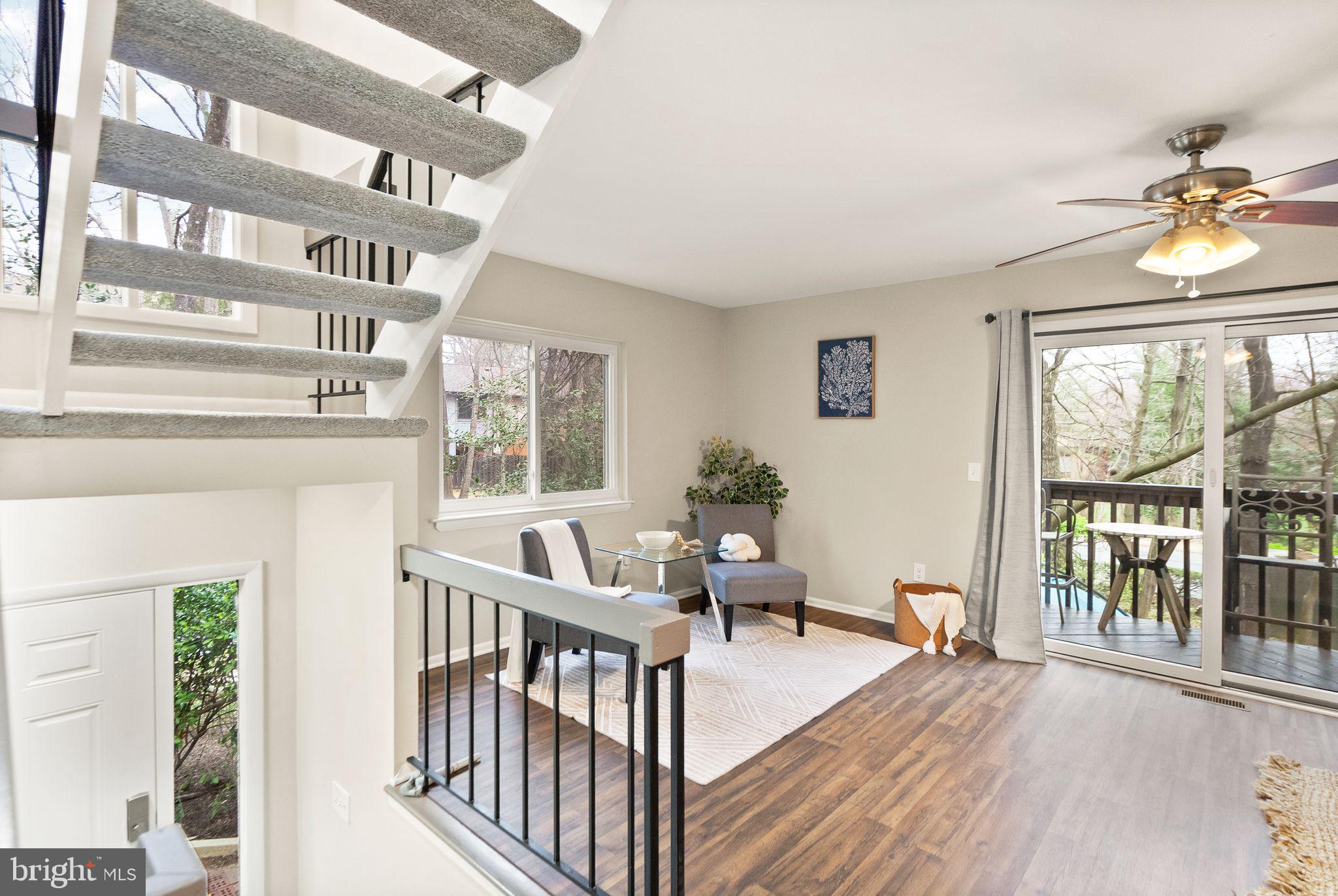11801 Coopers Court Reston, VA 20191 - Photo 8 of 66 a living room with furniture and a large window