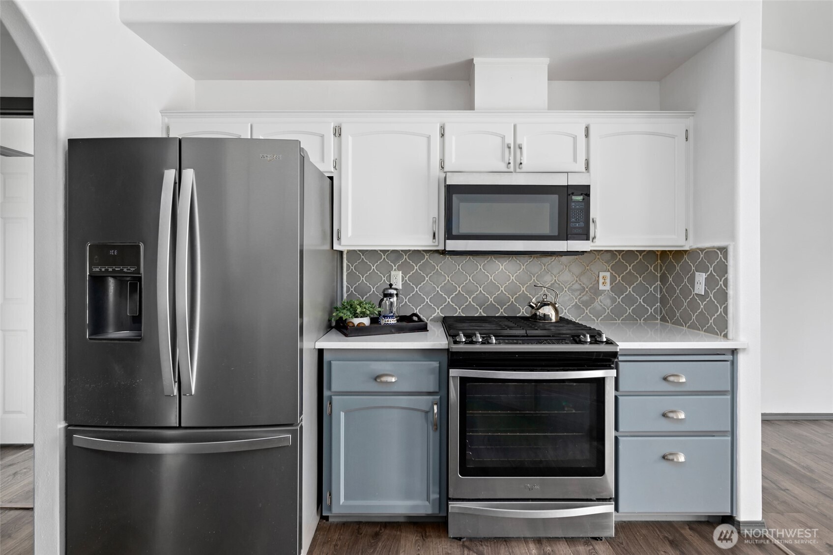 2060 Southwest 16th Avenue Oak Harbor, WA 98277 - Photo 11 of 40 a kitchen with stainless steel appliances white cabinets and a refrigerator