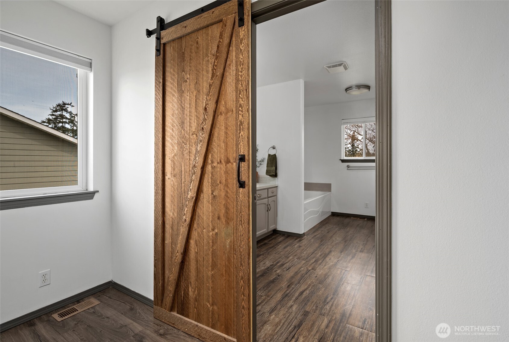 2060 Southwest 16th Avenue Oak Harbor, WA 98277 - Photo 19 of 40 a view of a hallway with wooden floor and closet