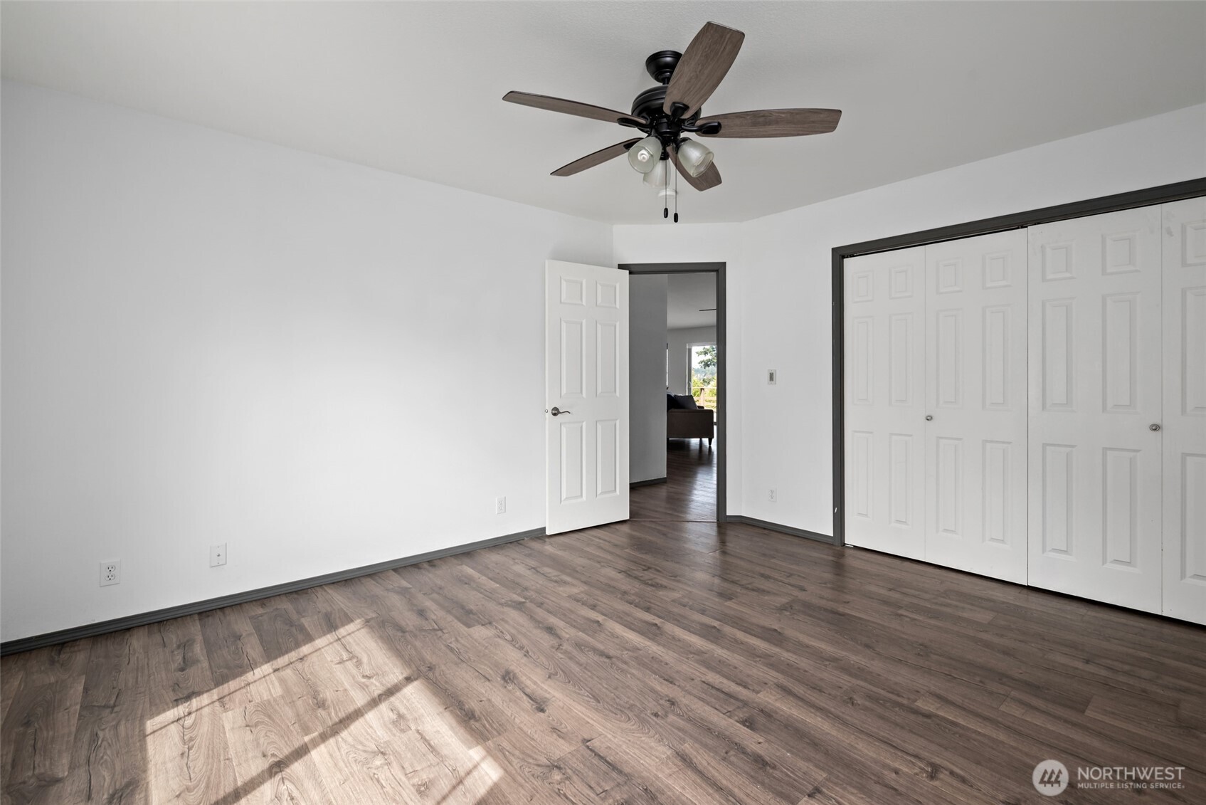 2060 Southwest 16th Avenue Oak Harbor, WA 98277 - Photo 23 of 40 a view of a room with wooden floor and ceiling fan