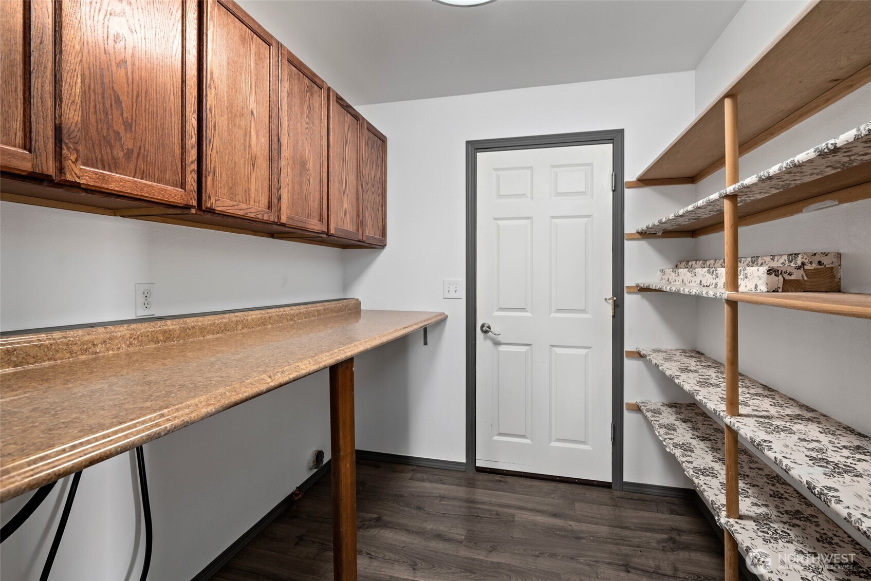 2060 Southwest 16th Avenue Oak Harbor, WA 98277 - Photo 28 of 40 a kitchen with cabinets and wooden floor
