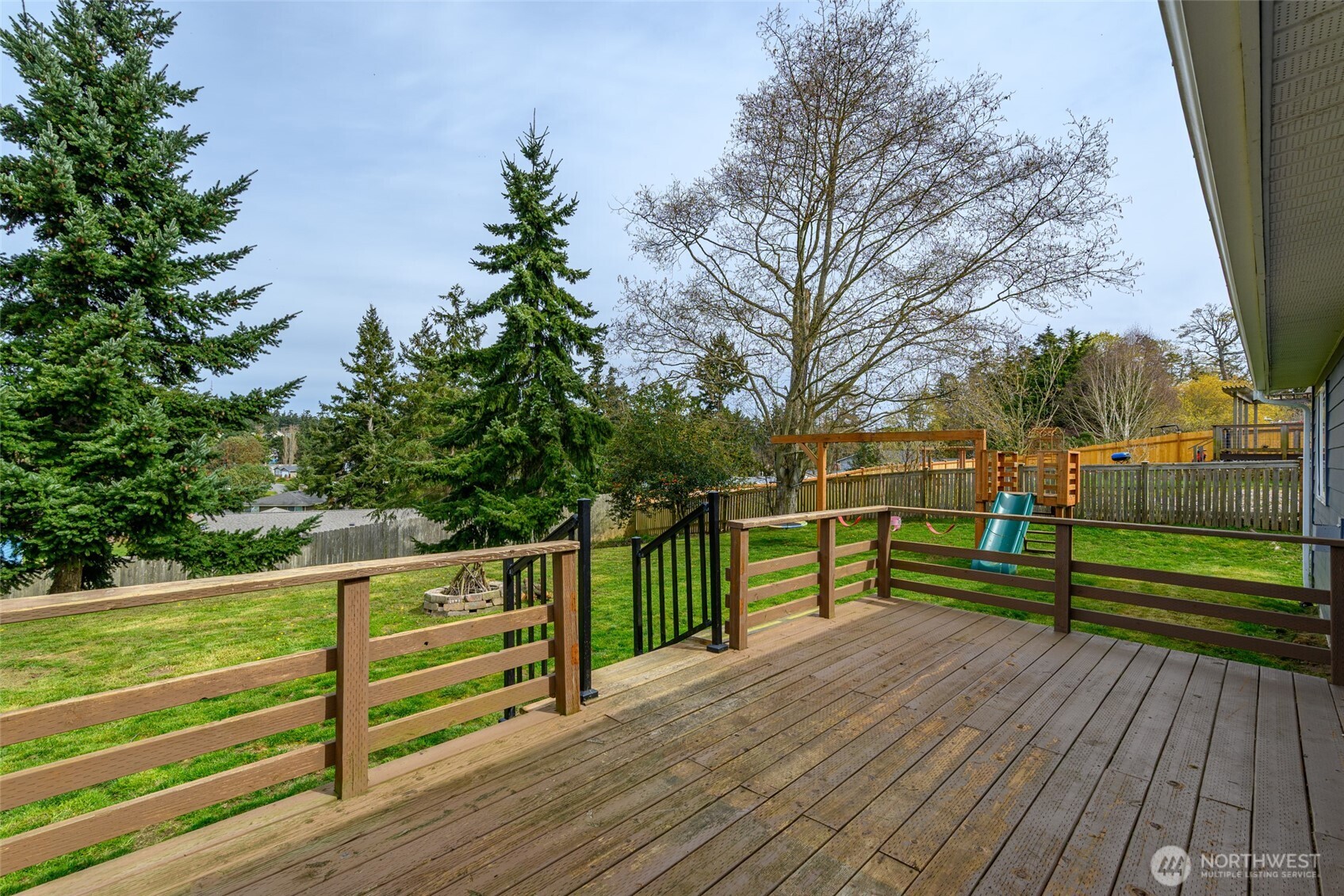 2060 Southwest 16th Avenue Oak Harbor, WA 98277 - Photo 32 of 40 a view of outdoor space with deck and trees