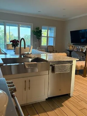 a view of living room with furniture and flat screen tv