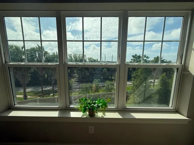 a view of room with window and furniture