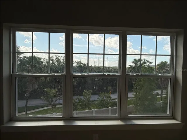 a bathroom with a bathtub and windows