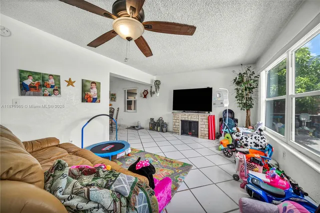 a bedroom with furniture and a flat screen tv