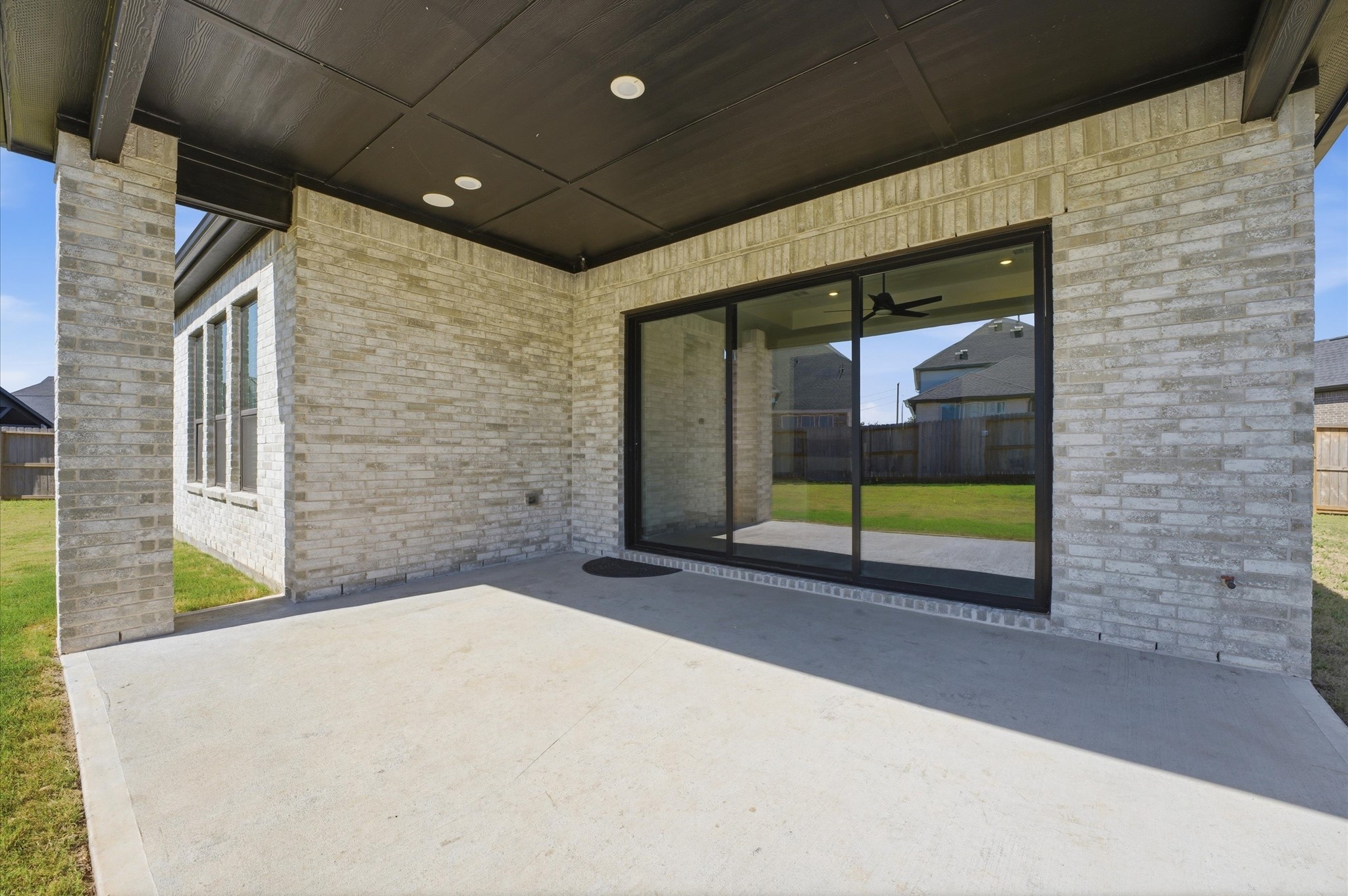 7327 Trial Rdg Drive Fulshear, TX 77441 - Photo 7 of 26 Imagine grilling, entertaining friends and family, or simply enjoying a quiet evening under the covered patio.
