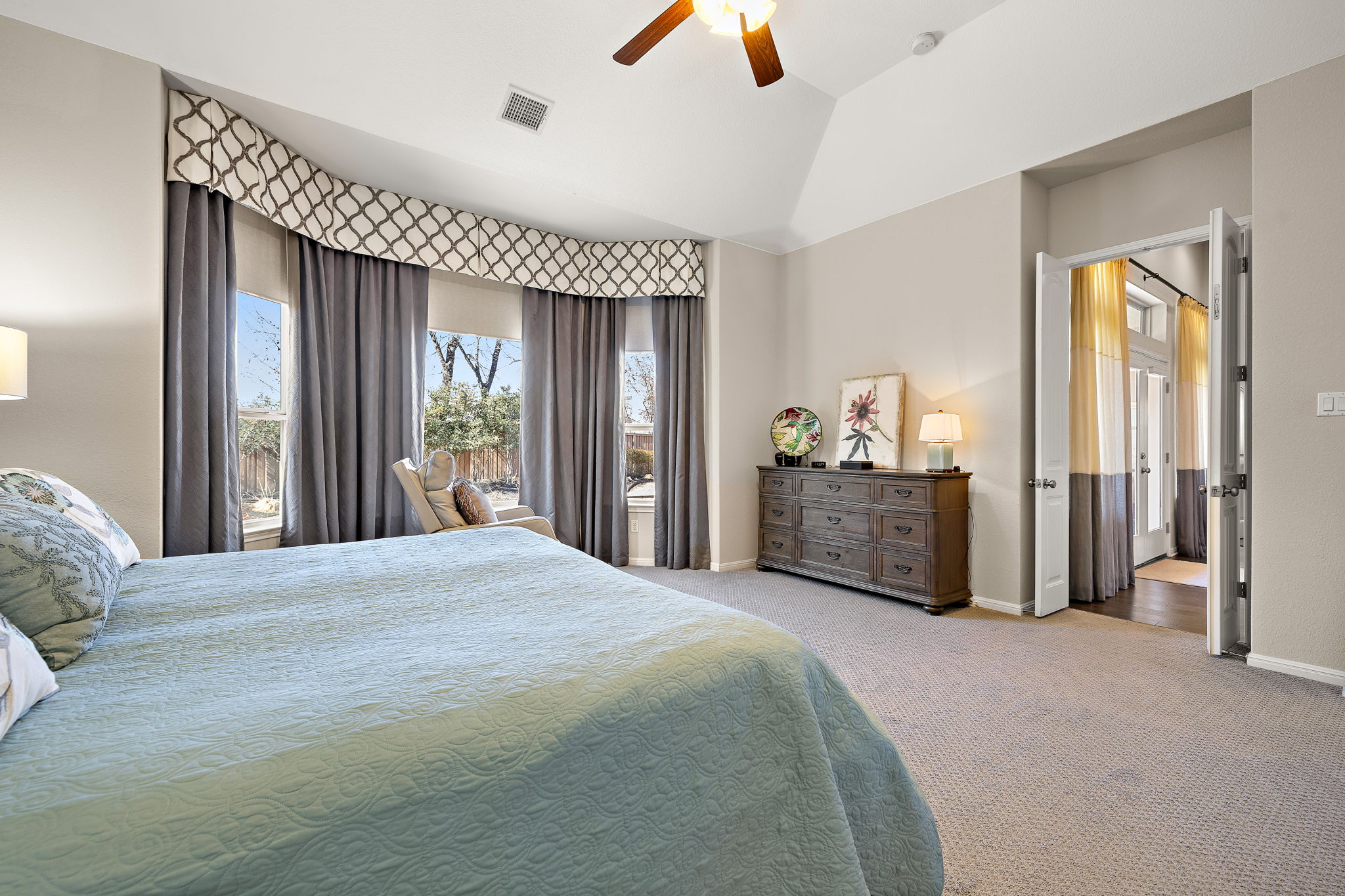 5016 Yucca Flower Lane Georgetown, TX 78626 - Photo 15 of 31 a spacious bedroom with a bed and a dresser