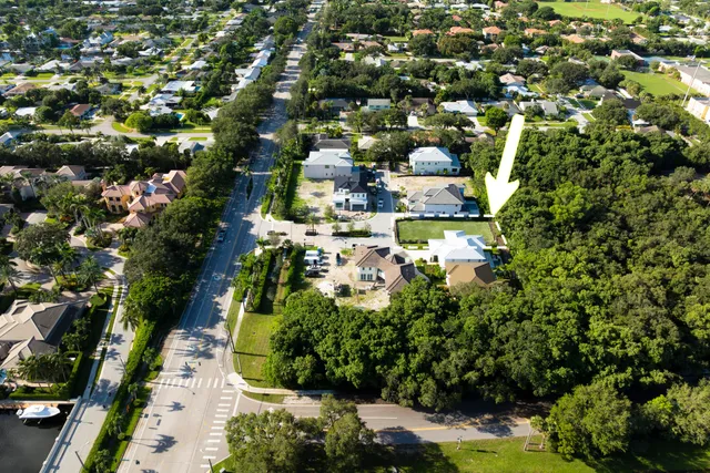 a view of a street with potted plants