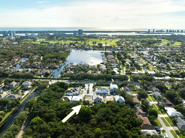 an aerial view of city and lake