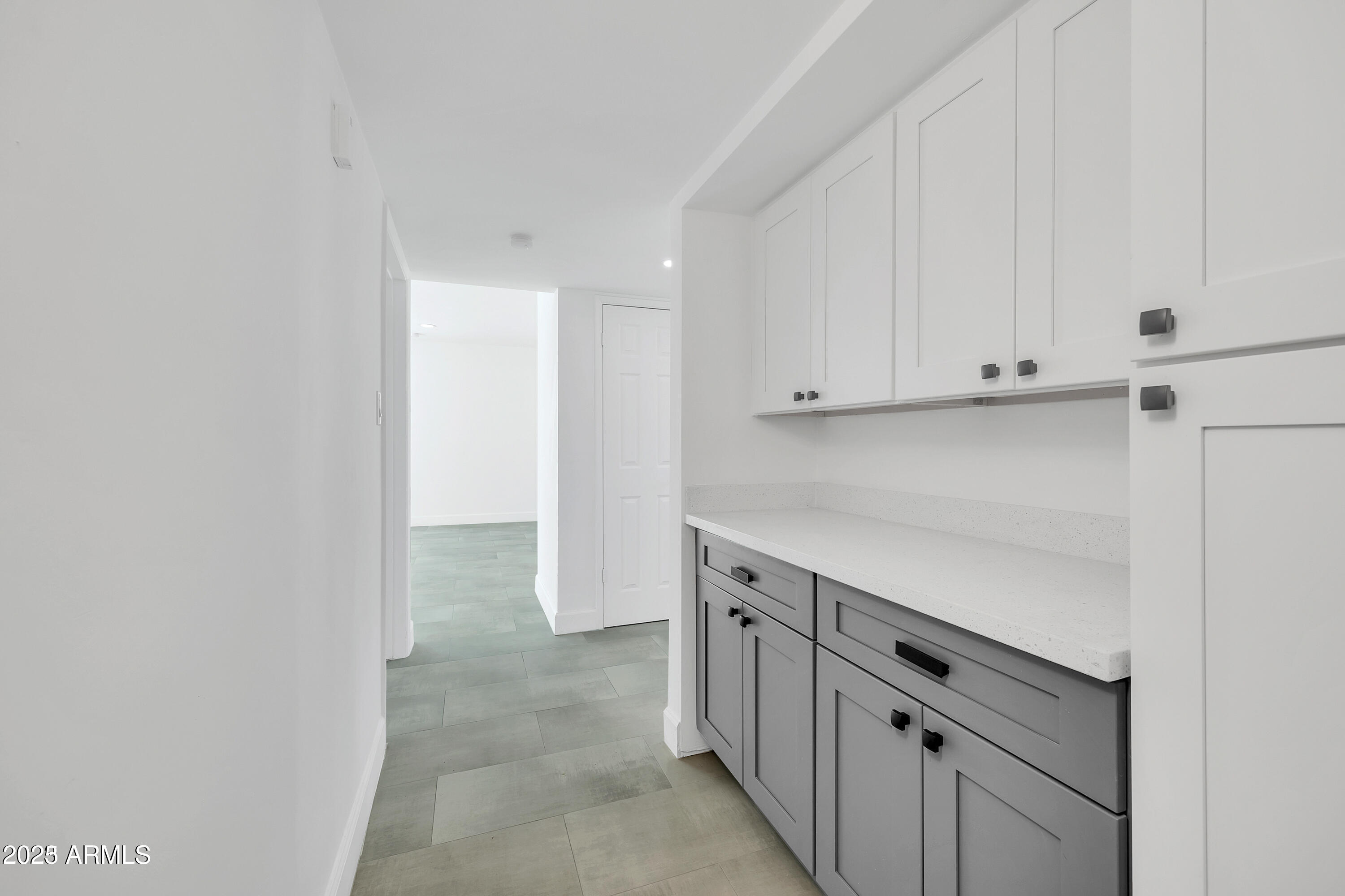1107 East Marlette Avenue Phoenix, AZ 85014 - Photo 12 of 28 a view of cabinets with wooden floor