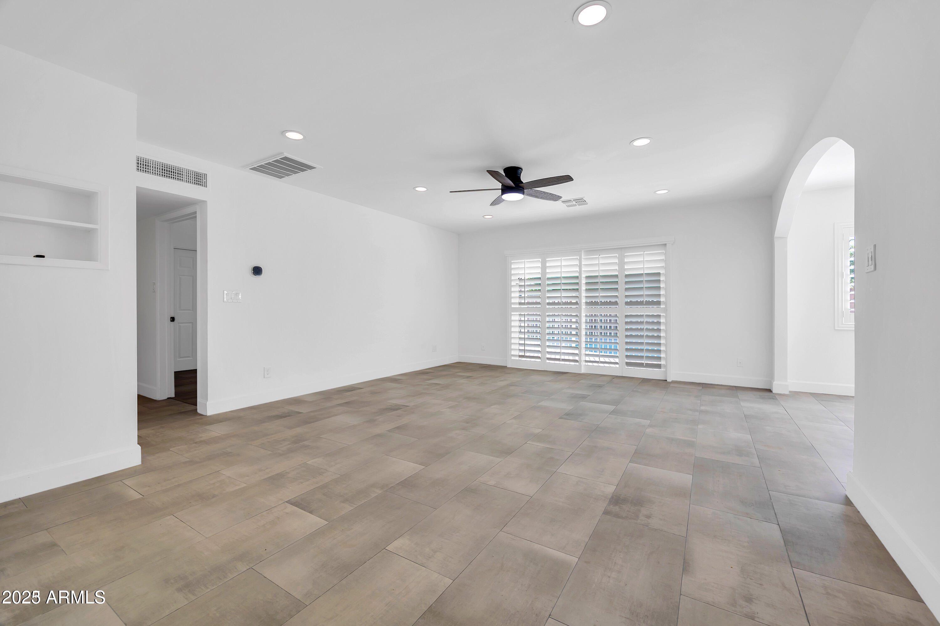 1107 East Marlette Avenue Phoenix, AZ 85014 - Photo 8 of 28 a view of an empty room with a window
