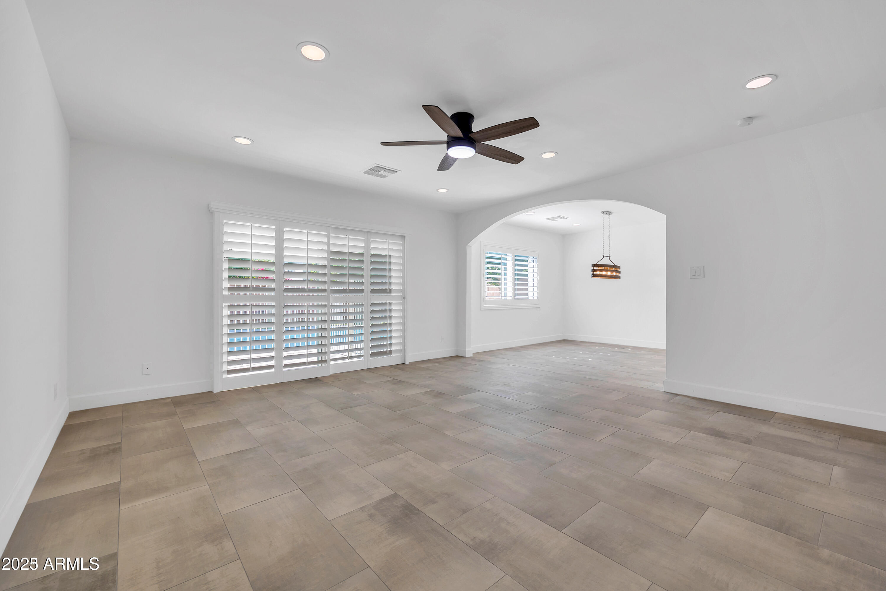 1107 East Marlette Avenue Phoenix, AZ 85014 - Photo 9 of 28 a view of an empty room with a window