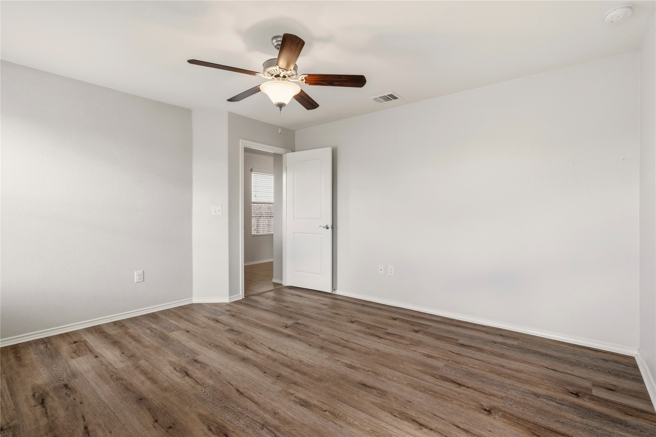 3721 Alpine Autumn Drive Austin, TX 78744 - Photo 15 of 29 wooden floor in an empty room