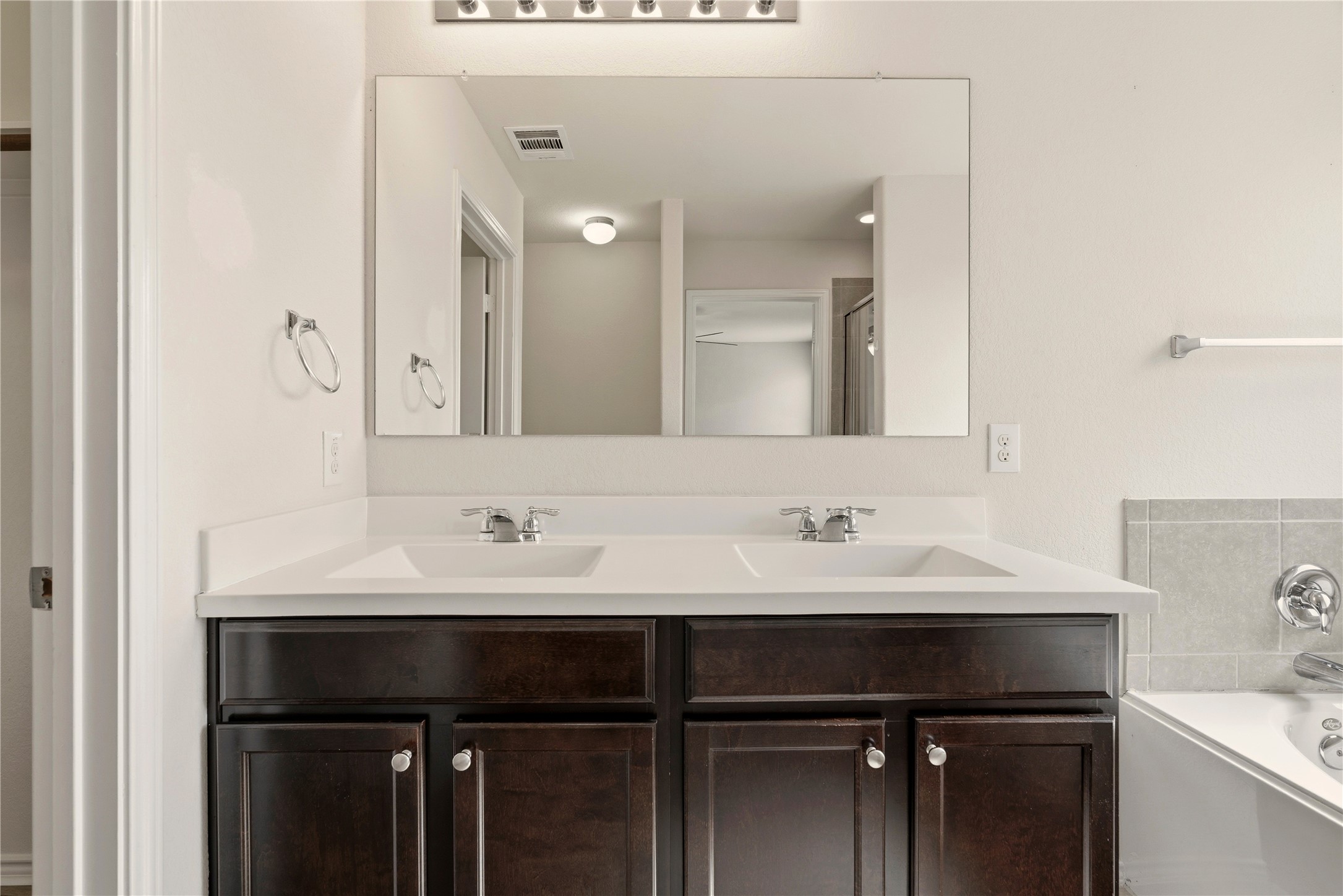 3721 Alpine Autumn Drive Austin, TX 78744 - Photo 19 of 29 a bathroom with a sink and a mirror