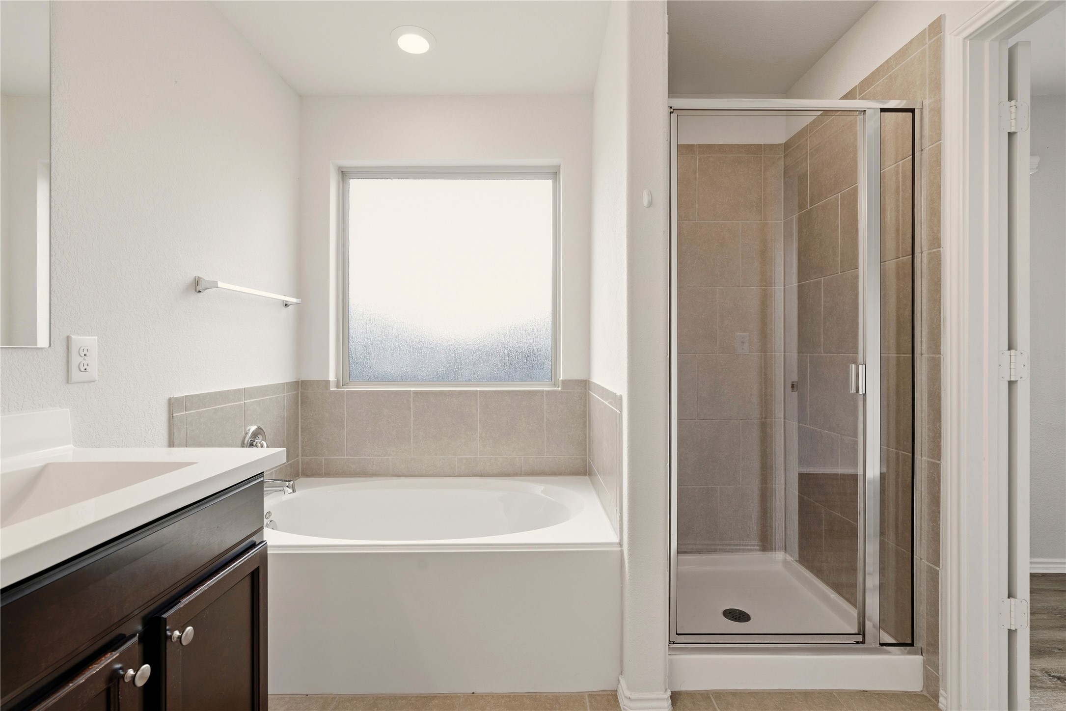 3721 Alpine Autumn Drive Austin, TX 78744 - Photo 20 of 29 a bathroom with a bathtub and a shower
