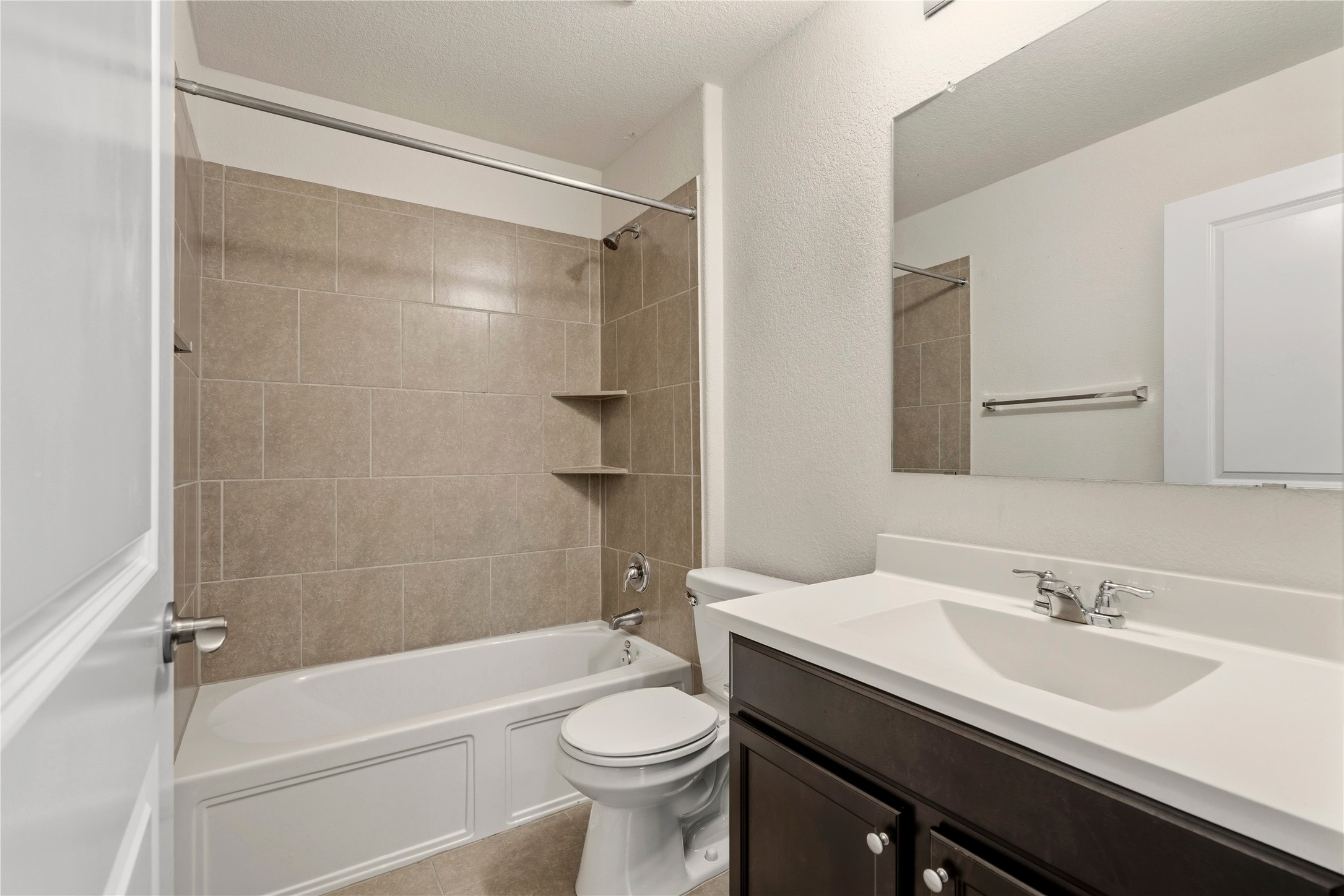 3721 Alpine Autumn Drive Austin, TX 78744 - Photo 26 of 29 a bathroom with a sink a toilet and shower